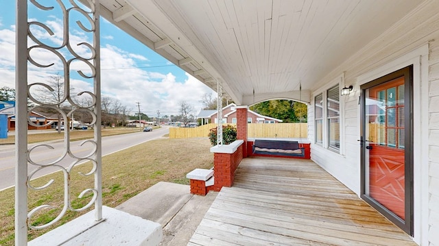 wooden terrace featuring a porch