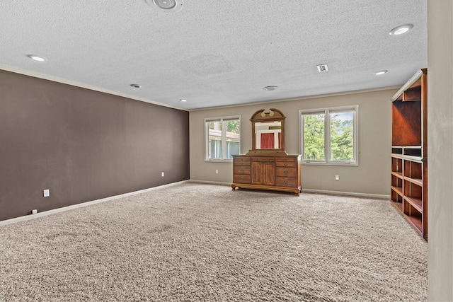 122 Greenview Cir, Dothan, AL 36301 - unfurnished living room with carpet, baseboards, a textured ceiling, recessed lighting, and crown molding