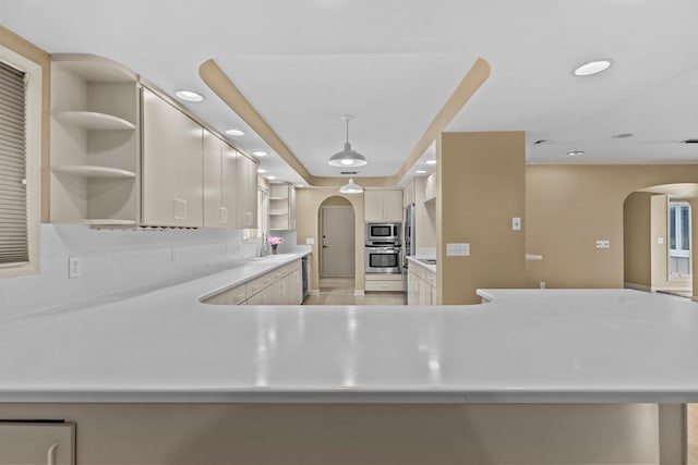 122 Greenview Cir, Dothan, AL 36301 - kitchen featuring open shelves, appliances with stainless steel finishes, arched walkways, light countertops, and recessed lighting