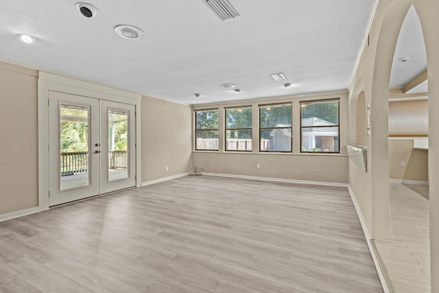 122 Greenview Cir, Dothan, AL 36301 - spare room with healthy amount of natural light, crown molding, french doors, light wood-style flooring, and baseboards