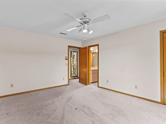 unfurnished room featuring ceiling fan and light colored carpet