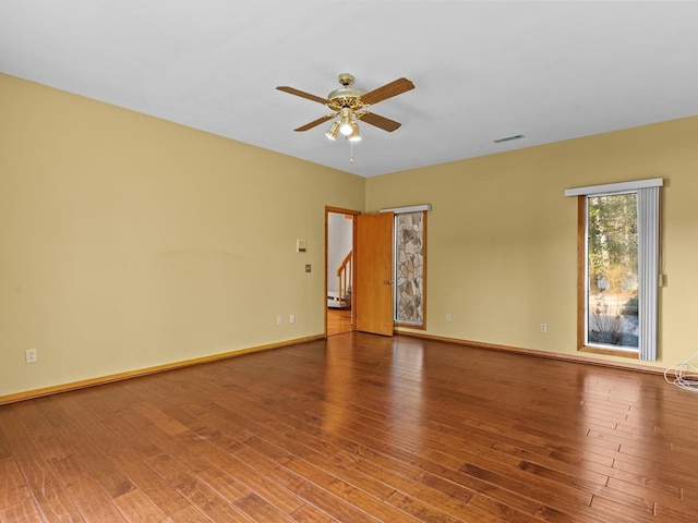 spare room with ceiling fan and hardwood / wood-style floors