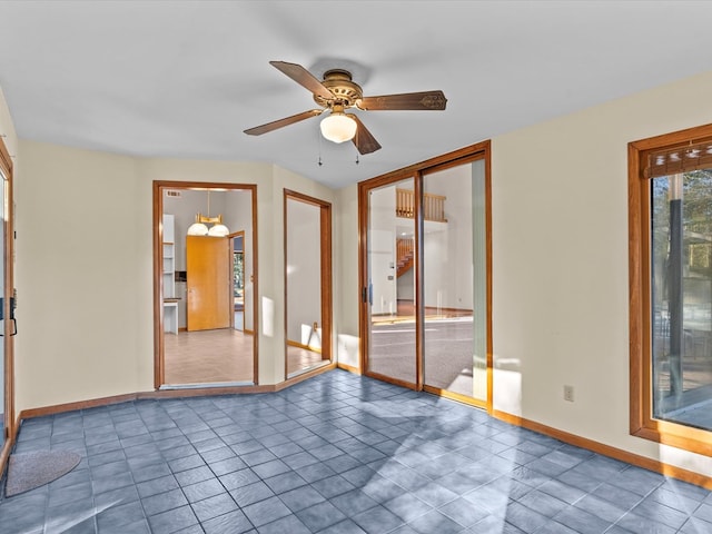 unfurnished room with ceiling fan