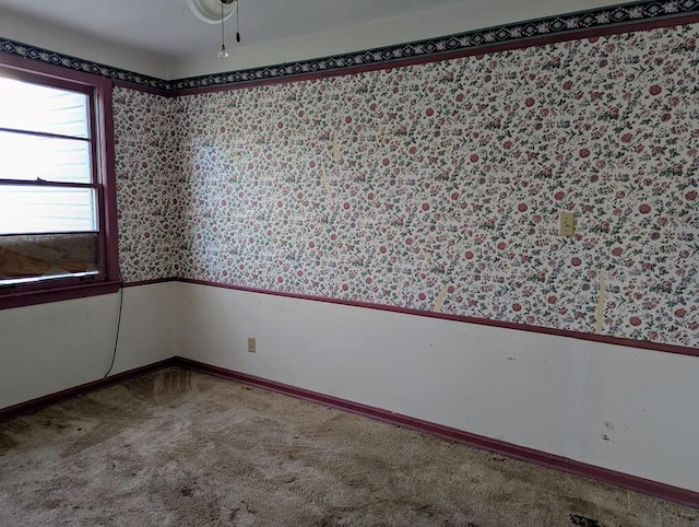 unfurnished room featuring carpet