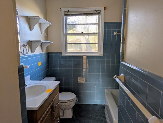 bathroom with tile walls, a bathtub, toilet, and tile patterned floors