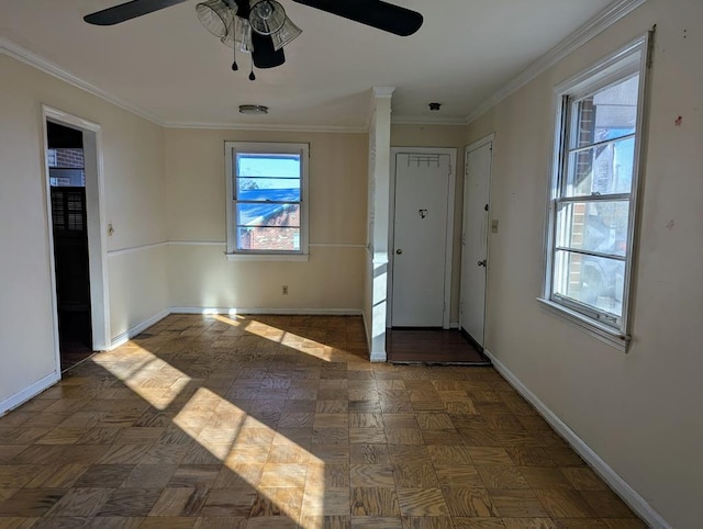 foyer with crown molding, ceiling fan, and dark parquet floors