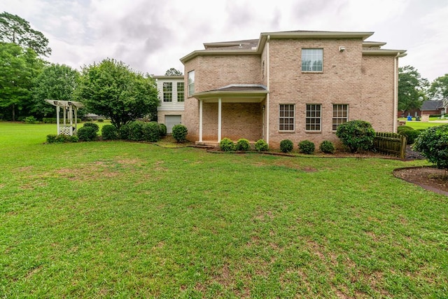 104 Ashwood Dr, Dothan, AL 36303 - rear view of property featuring brick siding and a lawn