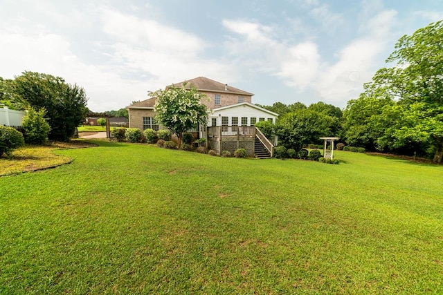 104 Ashwood Dr, Dothan, AL 36303 - view of green lawn featuring stairs and a wooden deck