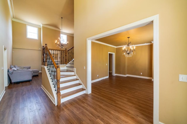 104 Ashwood Dr, Dothan, AL 36303 - stairway with a chandelier, crown molding, and wood finished floors