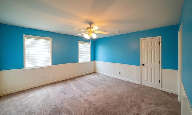 104 Ashwood Dr, Dothan, AL 36303 - unfurnished room with a wainscoted wall, ceiling fan, and carpet floors