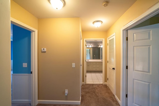 104 Ashwood Dr, Dothan, AL 36303 - hallway with dark colored carpet and baseboards
