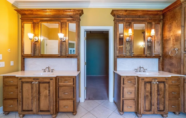 104 Ashwood Dr, Dothan, AL 36303 - bathroom with two vanities, backsplash, crown molding, and tile patterned flooring