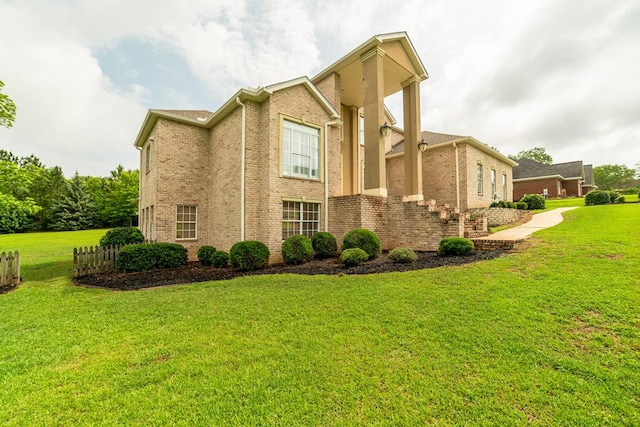 104 Ashwood Dr, Dothan, AL 36303 - view of property exterior with a yard and brick siding