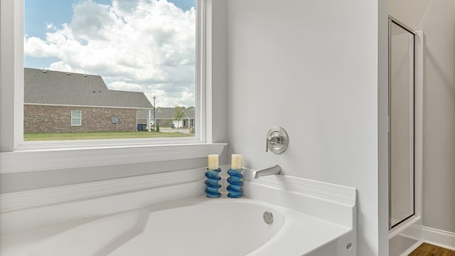 bathroom featuring a garden tub