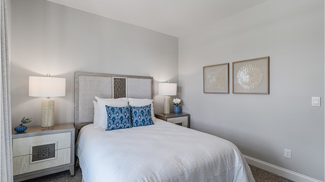 carpeted bedroom with baseboards