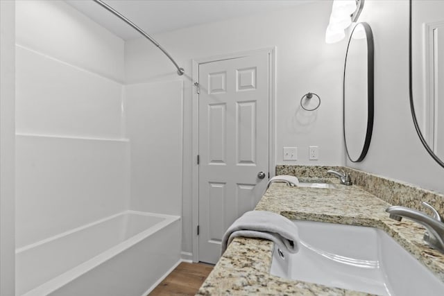 1182 N N Park Ave, Dothan, AL 36303 - full bathroom featuring  shower combination, wood finished floors, and double vanity