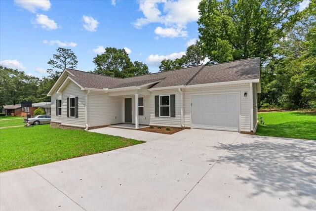 1182 N N Park Ave, Dothan, AL 36303 - ranch-style home with driveway, an attached garage, a front yard, and roof with shingles