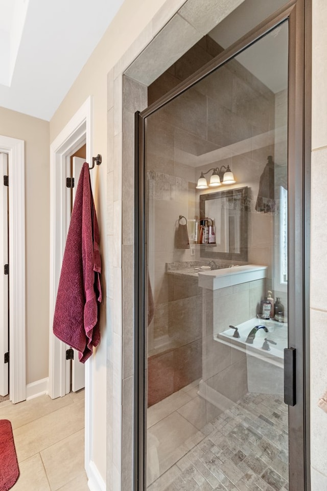 bathroom with tile patterned flooring and an enclosed shower