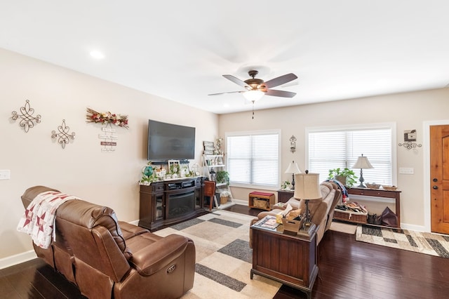 living room featuring ceiling fan and light hardwood / wood-style floors