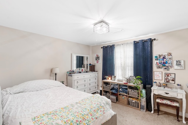 bedroom with light carpet