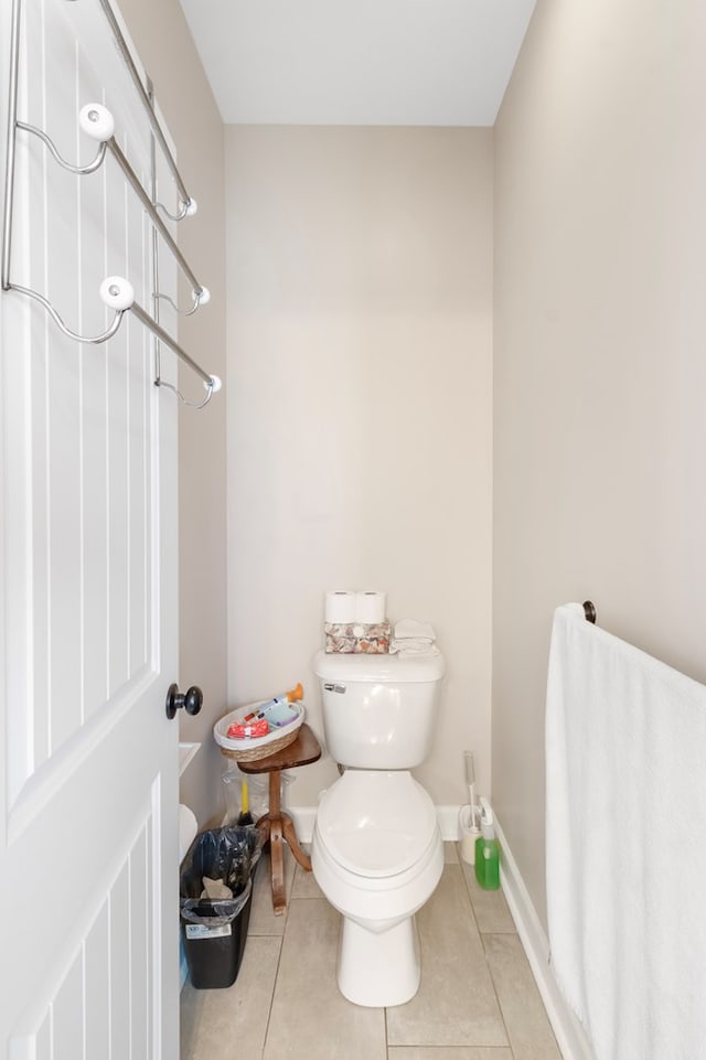 bathroom with tile patterned floors and toilet