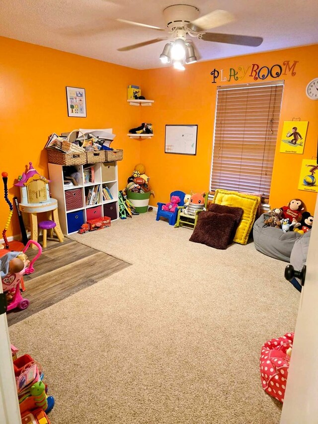 game room featuring ceiling fan and carpet