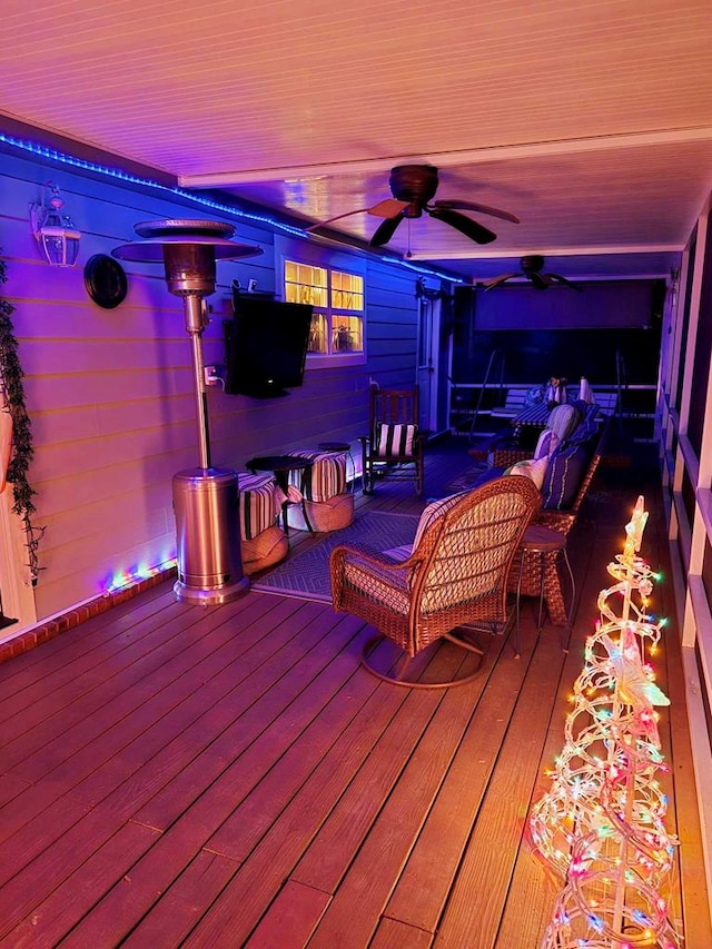 wooden deck featuring ceiling fan