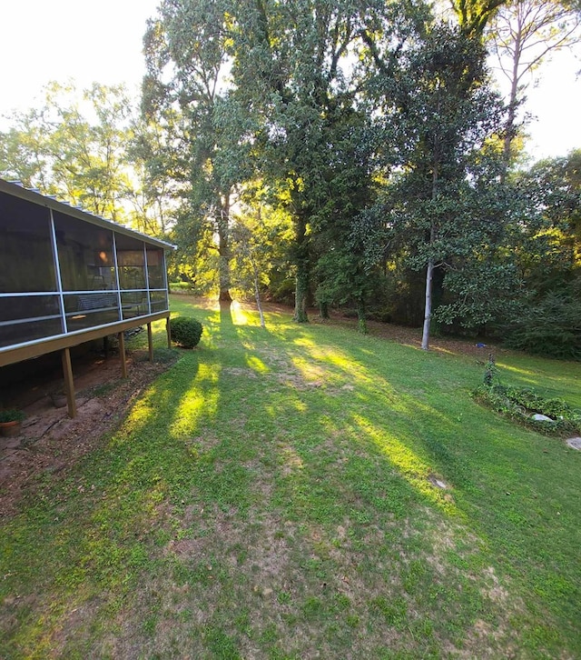 view of yard featuring a sunroom