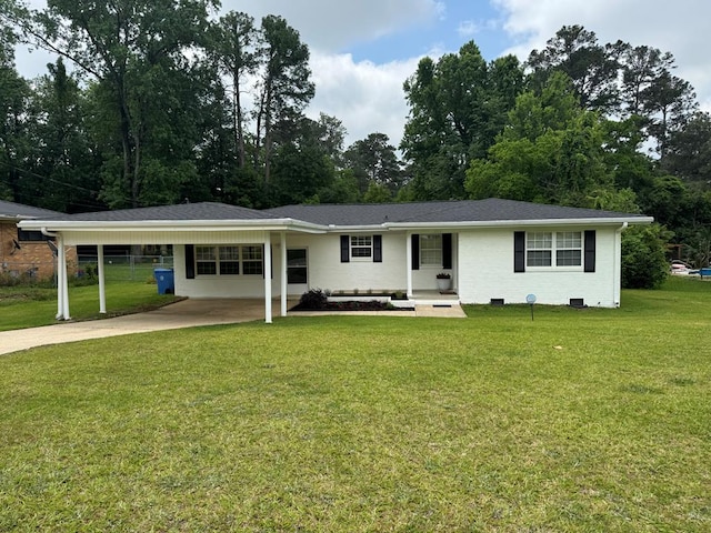 1303 Tacoma St, Dothan, AL 36303 - ranch-style home with driveway, an attached carport, and a front lawn