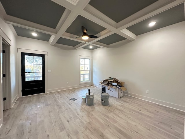 entryway featuring beam ceiling, light wood-type flooring, ceiling fan, and coffered ceiling