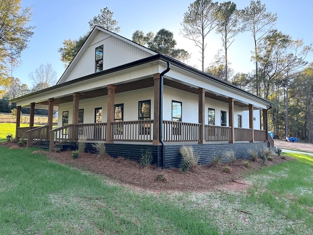 view of side of property with a porch