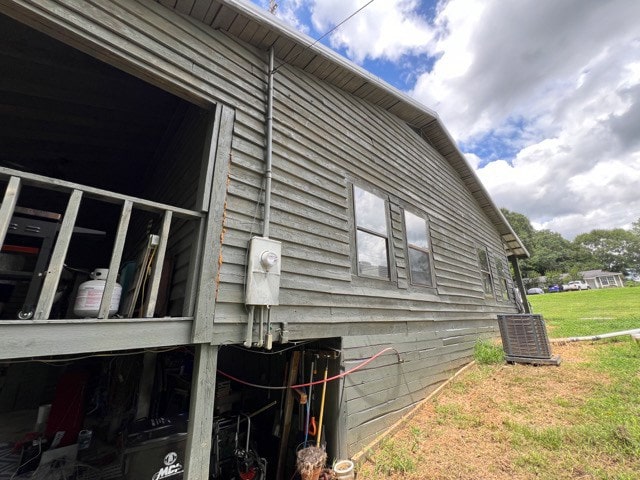 view of side of property with cooling unit