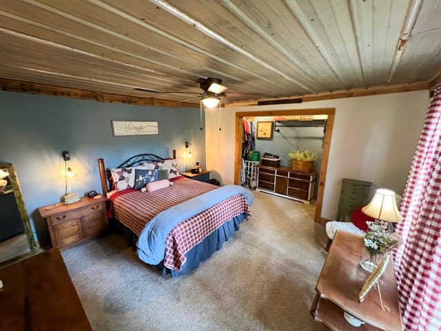 bedroom with carpet, ceiling fan, and wooden ceiling