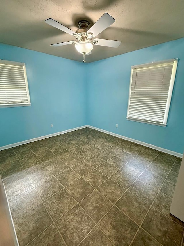 171 Merrydell Dr, Ozark, AL 36360 - empty room with ceiling fan and a textured ceiling