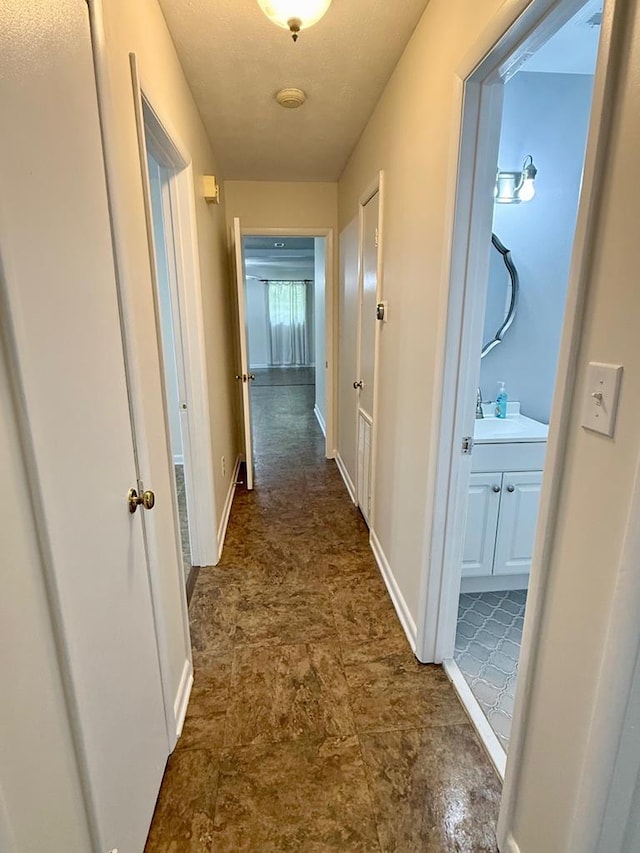171 Merrydell Dr, Ozark, AL 36360 - hallway with baseboards and stone finish flooring