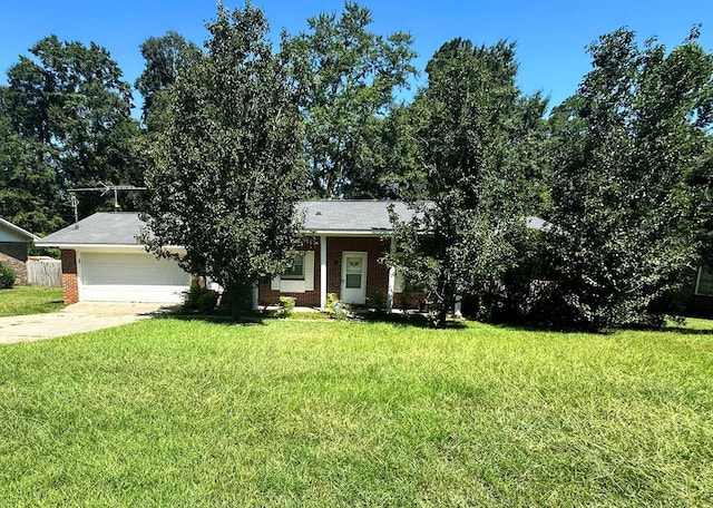 view of front facade featuring a garage, concrete driveway, brick siding, and a front yard