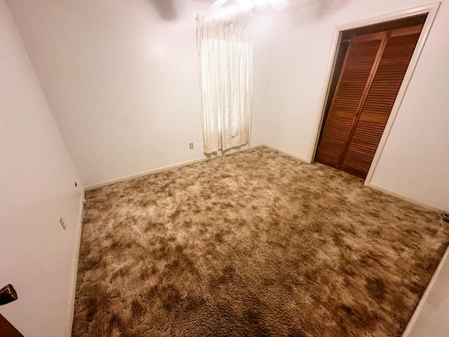 unfurnished bedroom with carpet flooring