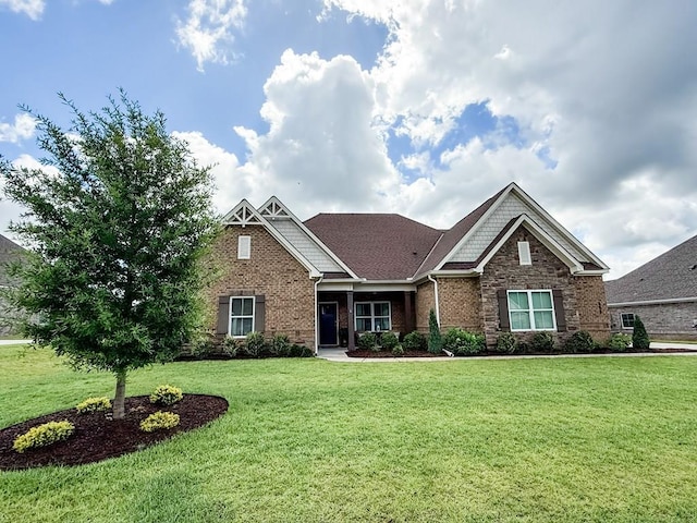 668 Charleston Mills Dr, Dothan, AL 36350 - craftsman-style house featuring a front yard and brick siding