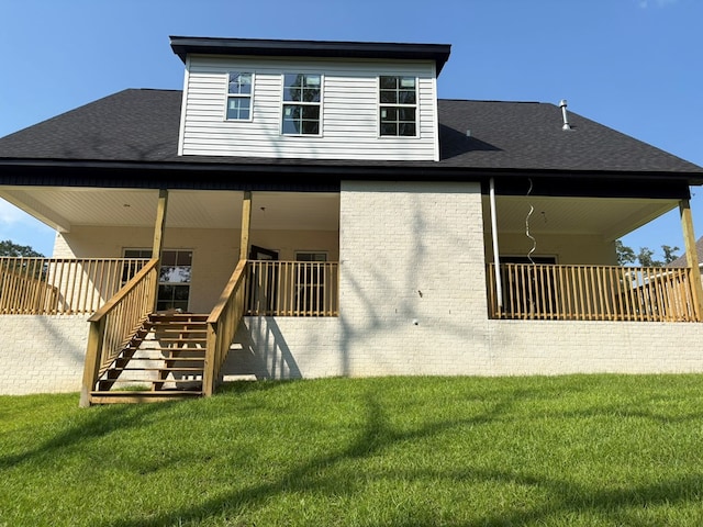 317 Old Village Rd, Ozark, AL 36360 - back of property featuring a lawn, roof with shingles, stairs, and brick siding