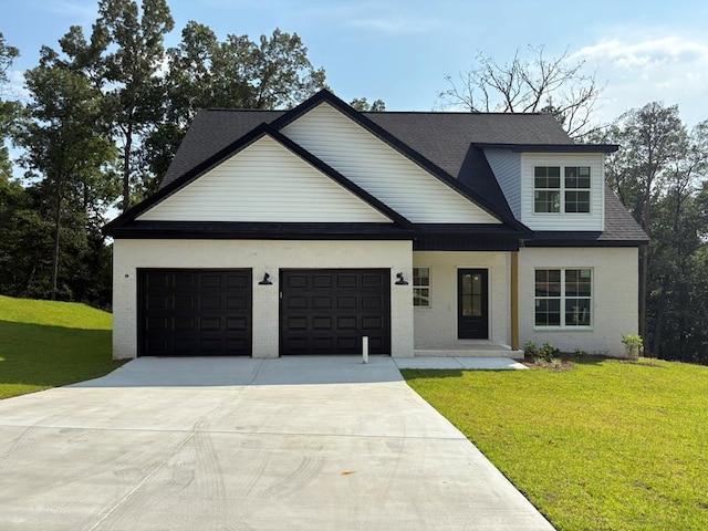 317 Old Village Rd, Ozark, AL 36360 - view of front of home with an attached garage, driveway, a front yard, and brick siding