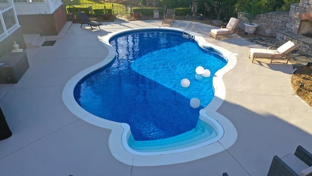 outdoor pool featuring a patio area