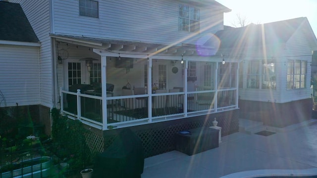 back of house with a sunroom