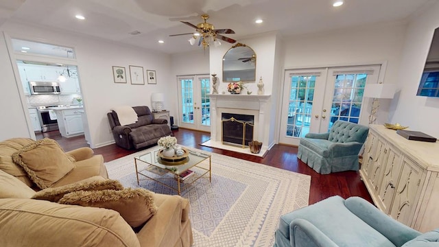 living area featuring recessed lighting, french doors, and dark wood-style flooring