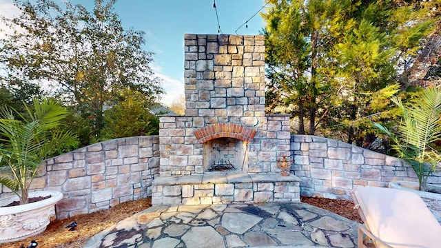 details featuring an outdoor stone fireplace