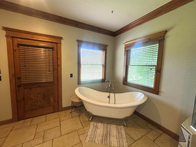 2837 Woodham Rd, Dothan, AL 36303 - bathroom with a freestanding tub, ornamental molding, and stone finish flooring