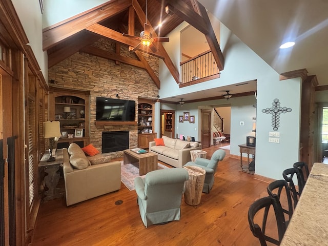 2837 Woodham Rd, Dothan, AL 36303 - living room featuring a ceiling fan, stairs, wood-type flooring, a fireplace, and high vaulted ceiling