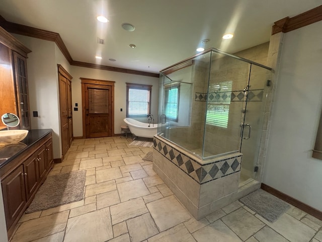 2837 Woodham Rd, Dothan, AL 36303 - full bath with ornamental molding, a freestanding tub, a stall shower, vanity, and recessed lighting