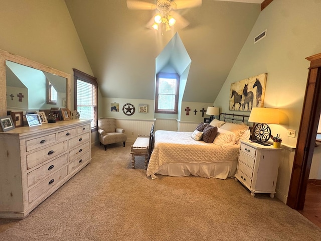 2837 Woodham Rd, Dothan, AL 36303 - bedroom featuring multiple windows, vaulted ceiling, light colored carpet, wainscoting, and a ceiling fan