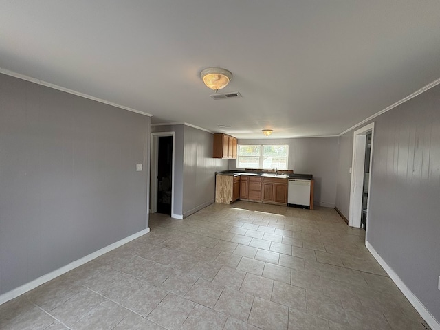 kitchen featuring crown molding, dishwasher, and sink