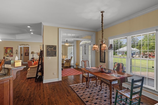 206 N Main St, Columbia, AL 36319 - dining room with dark hardwood / wood-style flooring, crown molding, a raised ceiling, and a chandelier